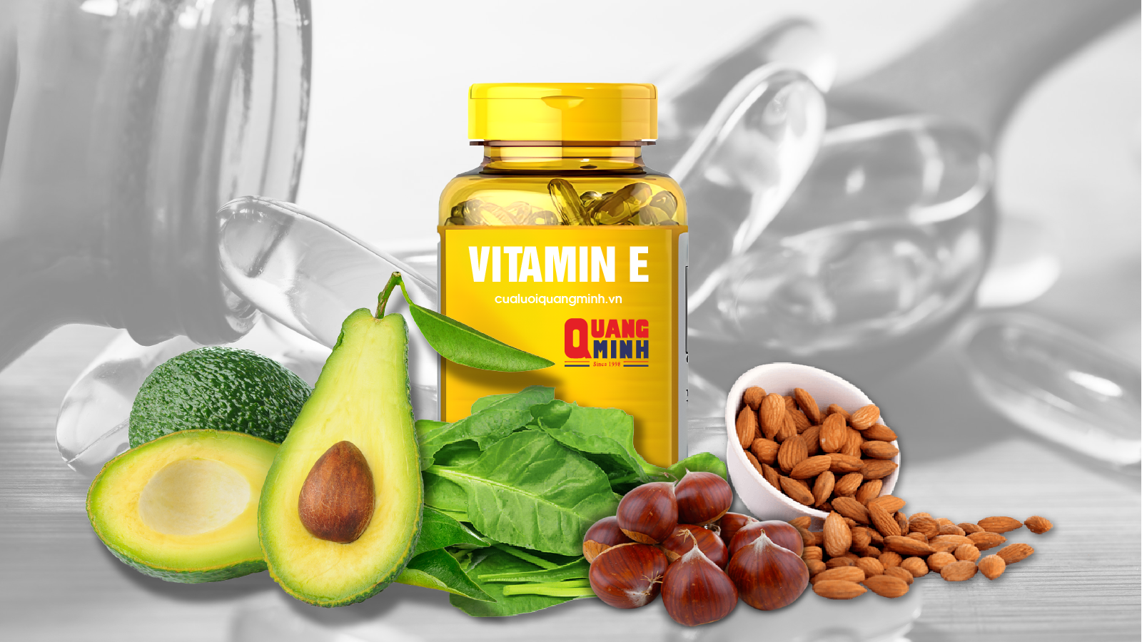 Hộp vitamin E, xung quanh là các loại thực phẩm giàu vitamin E như bơ, rau xanh...